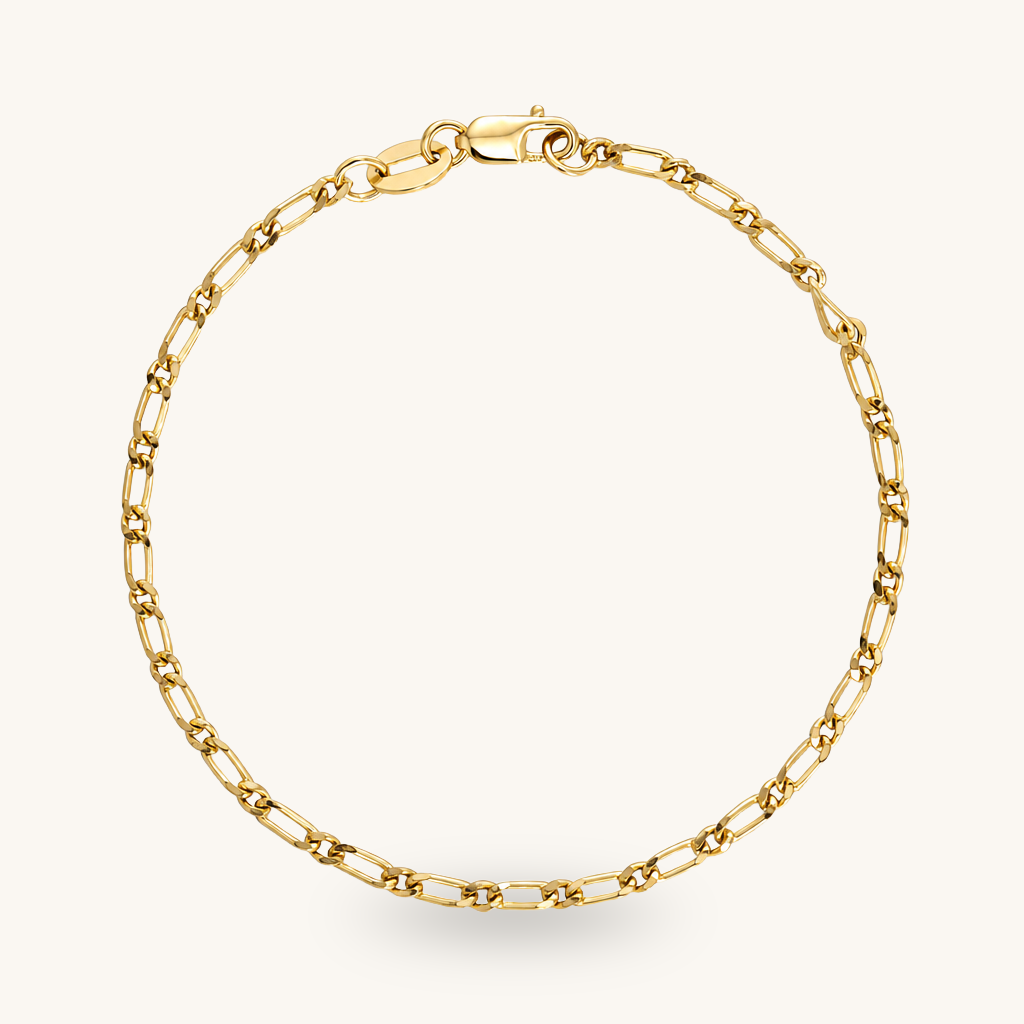 A gold chain bracelet with a classic paperclip link design and a lobster clasp, displayed on a clean off-white background.
