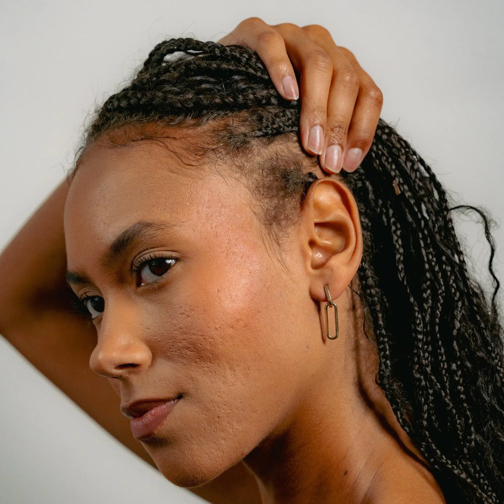 Paperclip drop earrings in solid 9ct gold worn with stacked necklaces | Glasaje