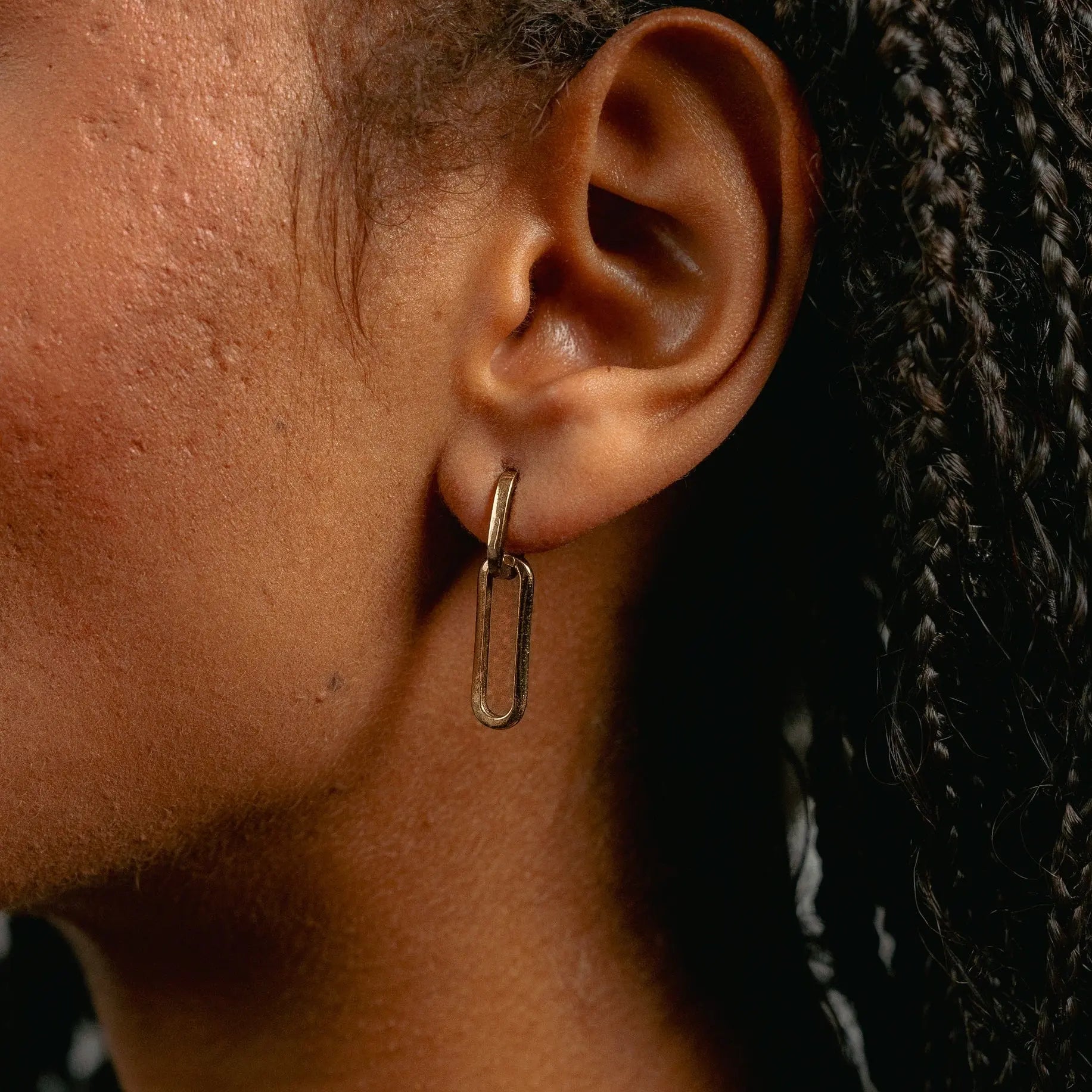 Model wearing Paperclip Earrings in 9ct solid gold, showing drop length