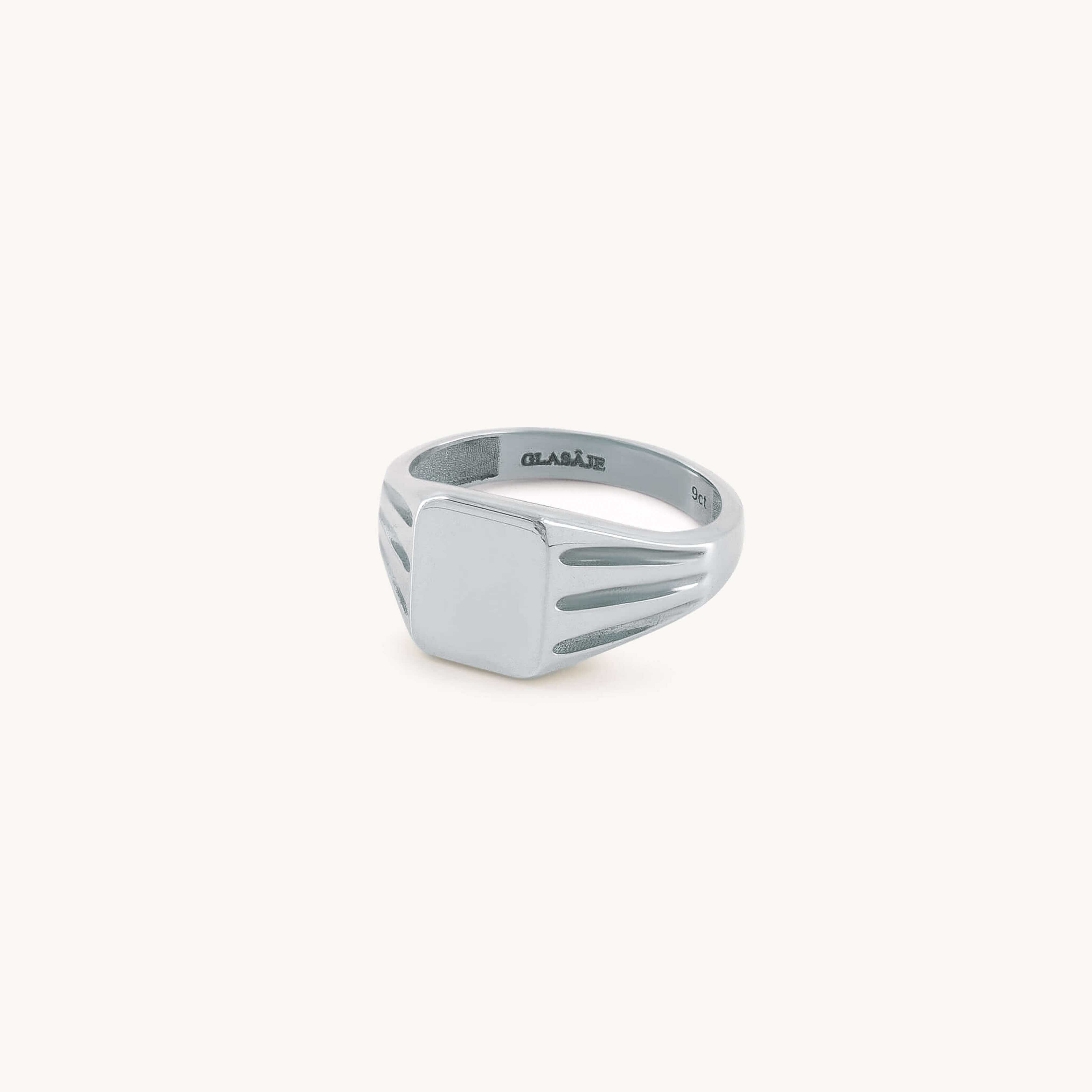 Silver ring with a unique design on a white background